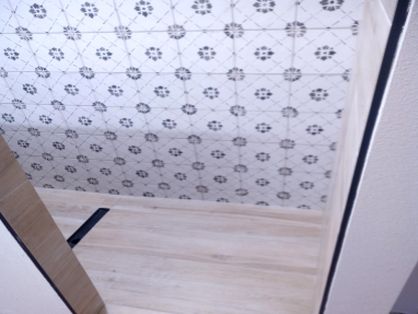 Wood look tile in shower floor and horizontal drain